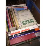 A box of music books, etc. Live bidding available via our website, if you require P&P please read