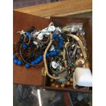 A wooden box of costume jewellery Live bidding available via our website, if you require P&P