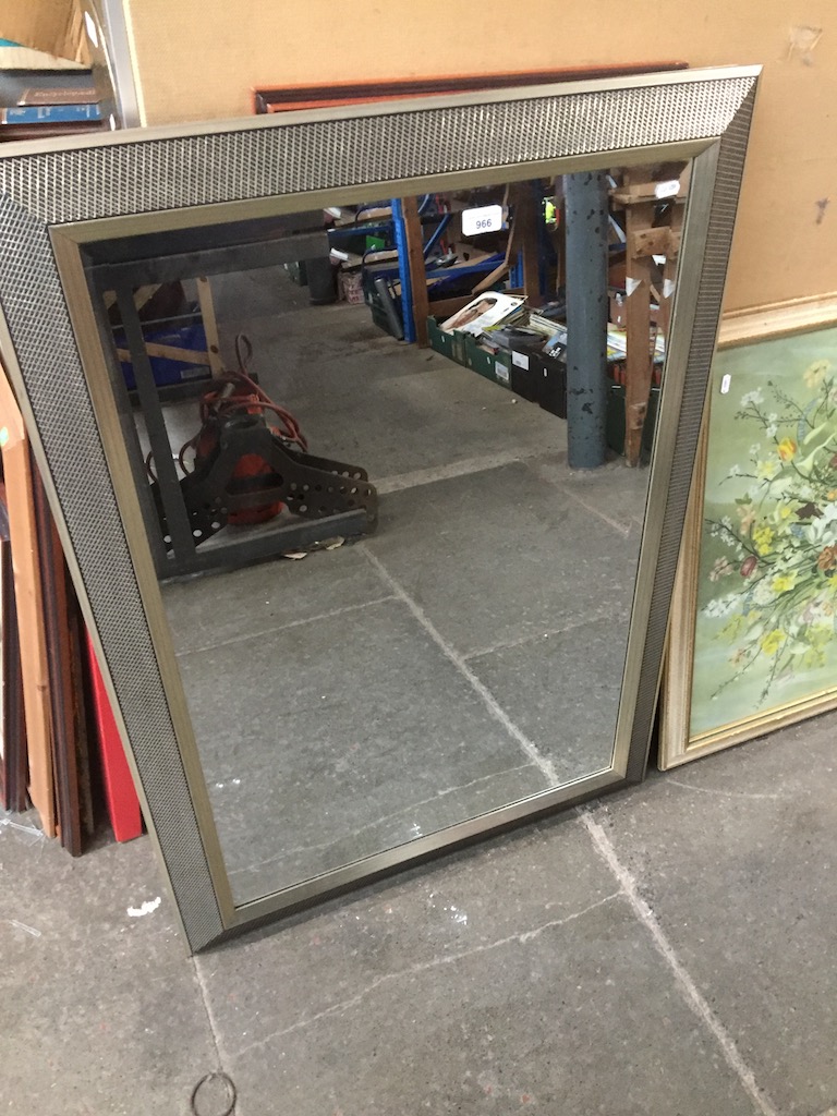 A large bevelled mirror 105 x 75 cm Live bidding available via our website, if you require P&P