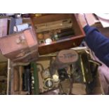 A box containing theodolite parts and various plate camera lenses Live bidding available via our