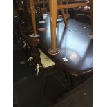An Ercol dining table with four fleur de lys back chairs, table h73cm, L183cm, w80cm. Live bidding