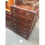 A reproduction tall chest of drawers, h108cm, w66cm. Live bidding available via our website, if