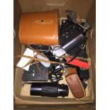 A box of cameras and binoculars Live bidding available via our website, if you require P&P please