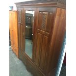 An Edwardian mirror door wardrobe, h202cm, w156cm, d52cm. Live bidding available via our website, if