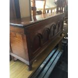 An oak priory style coffer, h48cm w111cm, d29cm. Live bidding available via our website, if you