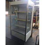 A large shop display fridge Live bidding available via our website, if you require P&P please read