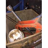 A tin box with jack, wheel brace and other jack. Live bidding available via our website, if you