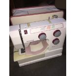 A Riccar electric sewing machine, no power lead. Live bidding available via our website, if you