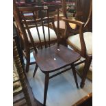 An Ercol spindle back chair Live bidding available via our website, if you require P&P please read