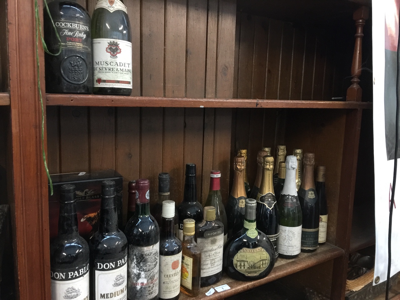 A quantity of mixed alcoholic drinks including wines, champagne, whisky, rum and a bottle of Chateau