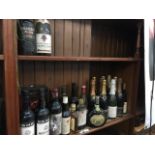 A quantity of mixed alcoholic drinks including wines, champagne, whisky, rum and a bottle of Chateau