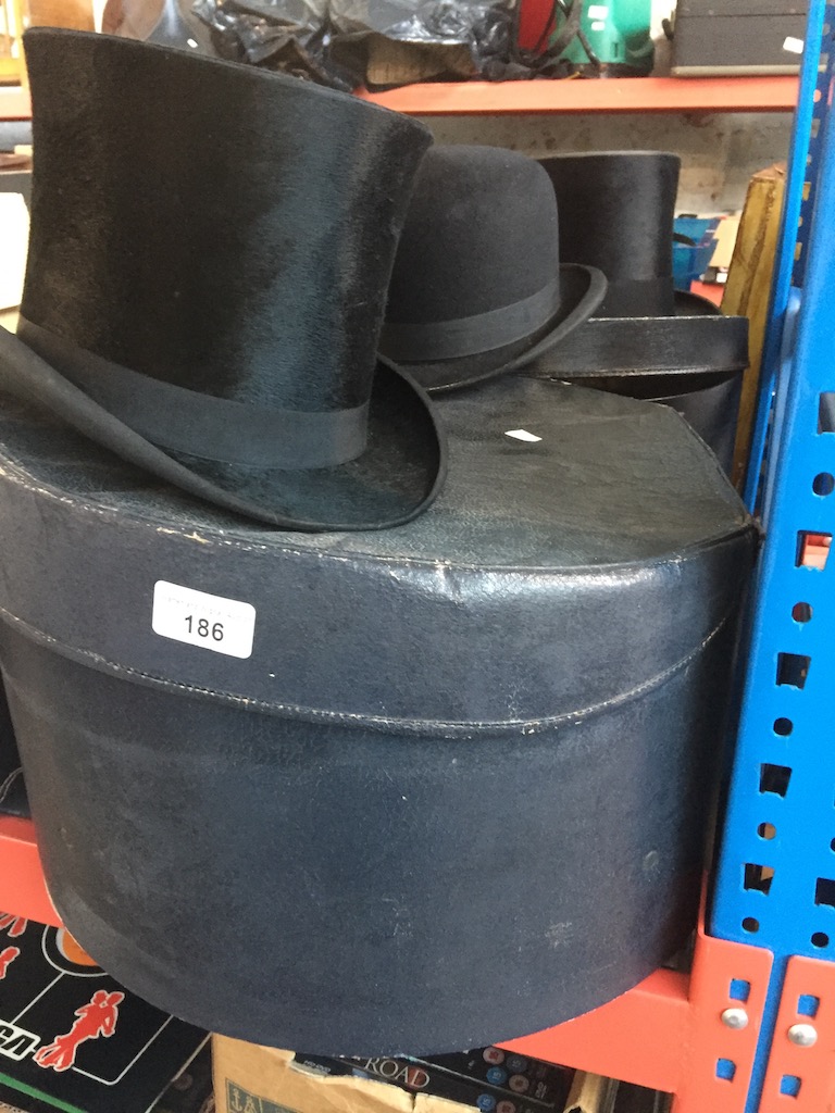 2 hat boxes containing 2 top hats and a bowler hat. Live bidding available via our website, if you