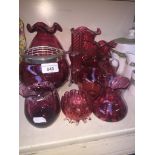 Nine pieces of cranberry glass Live bidding available via our website, if you require P&P please