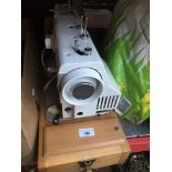 Electric New Home sewing machine with cover, lead. Live bidding available via our website, if you