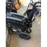 A folding wheelchair Live bidding available via our website, if you require P&P please read
