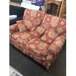 A crimson patterned two seater sofa Live bidding available via our website, if you require P&P