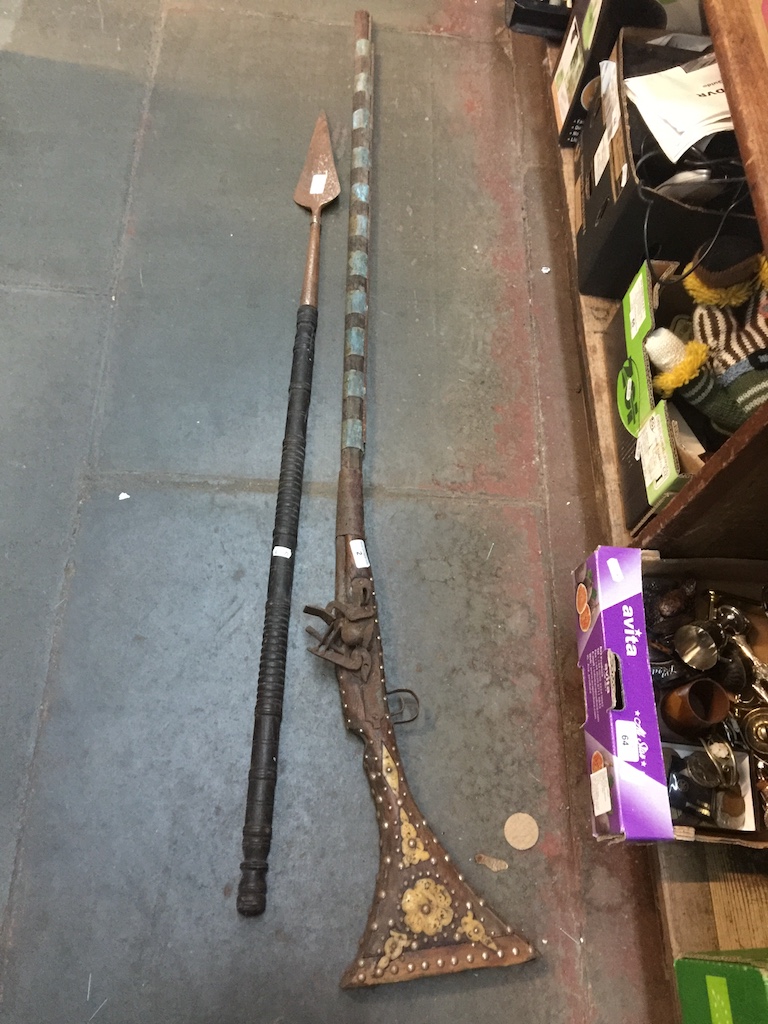 A middle eastern inlaid rifle and a spear Live bidding available via our website, if you require P&P