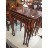 A mahogany nest of tables on cabriole legs Live bidding available via our website, if you require