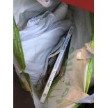 A bag of linen and cake decorating books Live bidding available via our website, if you require P&