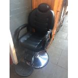 An adjustable barbers chair - left arm damaged. Live bidding available via our website, if you