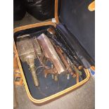 A brown suitcase with leather whip, carriage lamp, wood plane, shillelagh, etc. Live bidding