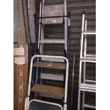 A set of aluminium step ladders, another metal and wood set, and metal steps (3 sets) Live bidding