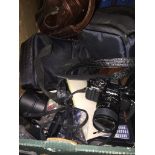 A box of cameras and accessories including lenses, Sony cybershot, Minolta SLR, etc Live bidding