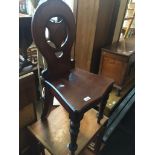A 19th century mahogany hall chair Live bidding available via our website, if you require P&P please