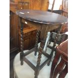 A twist oak side table Live bidding available via our website, if you require P&P please read