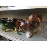 Two pottery horses and carts Live bidding available via our website, if you require P&P please