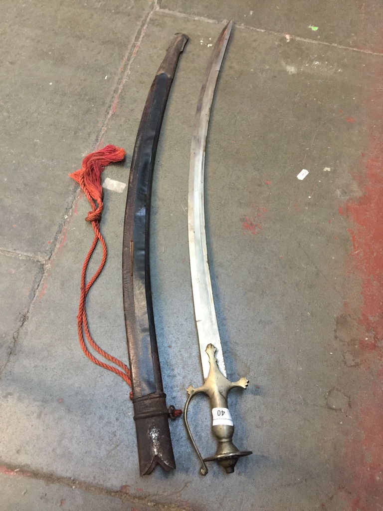 A 19th century curved and single edged blade sword Live bidding available via our website, if you