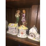 Three Coalport china cottages and a pair of Italian figures Live bidding available via our