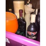 A box of spirits, some empty bottles, an orange large glass / goblet, etc. Live bidding available
