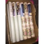 A box of various rolls of wallpaper Live bidding available via our website, if you require P&P