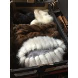 A box of fur hats and other fur Live bidding available via our website, if you require P&P please