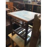 A small teak and tile top table Live bidding available via our website, if you require P&P please
