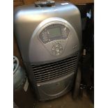 An air cooler and ioniser, with remote. Live bidding available via our website, if you require P&P