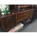 A walnut veneered reproduction breakfront sideboard. Live bidding available via our website, if
