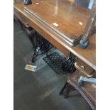 A Singer treadle sewing machine Live bidding available via our website, if you require P&P please