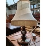 A turned wooden table lamp Live bidding available via our website, if you require P&P please read