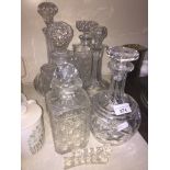 Six glass decanters and two knife rests Live bidding available via our website, if you require P&P