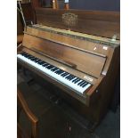 A Kimball U.S.A. upright piano, model no.X420, h106cm, w144cm d56cm. Live bidding available via