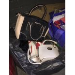 A bag of handbags Live bidding available via our website, if you require P&P please read important