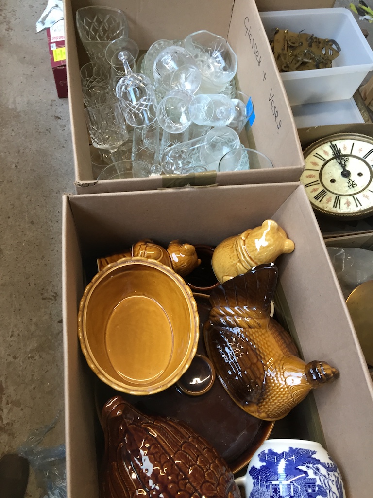 A box of glass and a box of pottery.