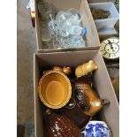 A box of glass and a box of pottery.