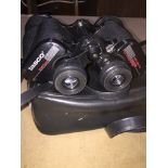 A set of Tasco binoculars in case.