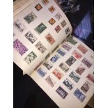The Strand stamp album and some loose stamps