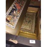 A box of Oriental textile pictures