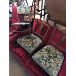 A pair of Edwardian inlaid nursing chairs and a bedroom chair