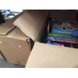 2 large boxes of 49 Jigsaw puzzles, range from 500 to 1000 pieces.
